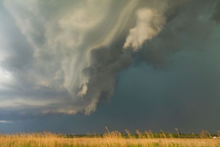 A storm traveling over a field